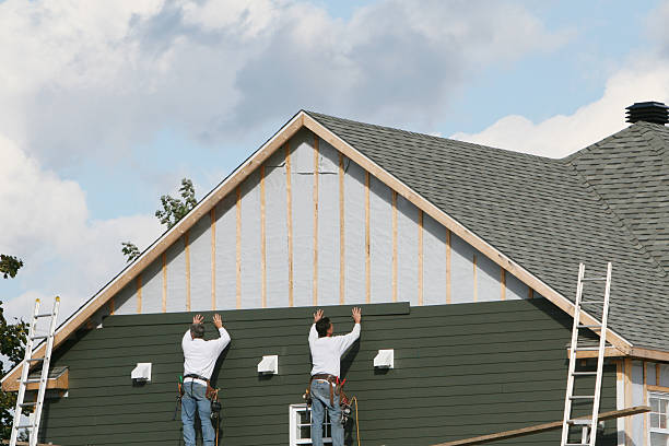 Professional Storm Damage Siding Repair technician working in Inverness, IL